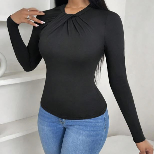 Black pleated collar slim fit top by Alabaster, featuring a curve-hugging design for elegant occasions.