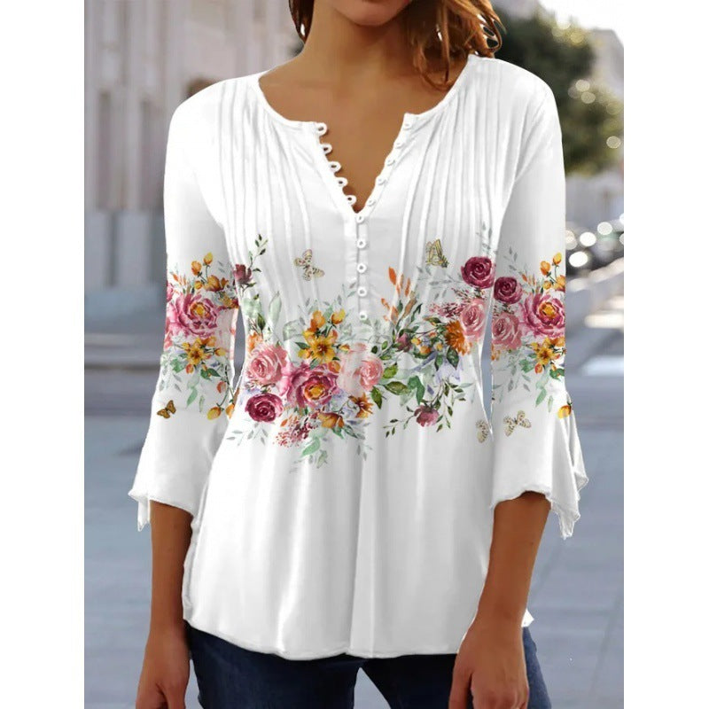 White floral V-neck pleated blouse with 3/4 sleeves and button front by Alabaster