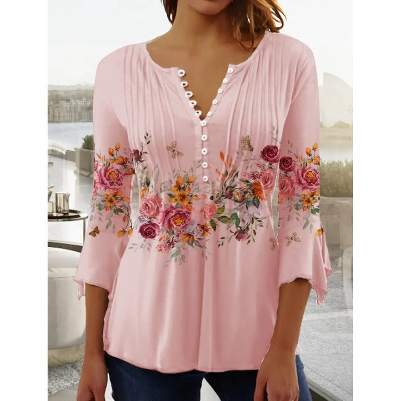 White floral V-neck pleated blouse with 3/4 sleeves and button front by Alabaster