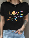 Black graphic t-shirt featuring 'I Love Art' design, perfect for art lovers, by Alabaster, available in sizes S, M, L.