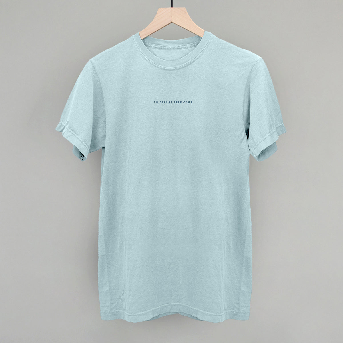 Light blue cotton tee from Ivy + Cloth's Pilates Is Self Care Collection, perfect for cozy athleisure and fitness.