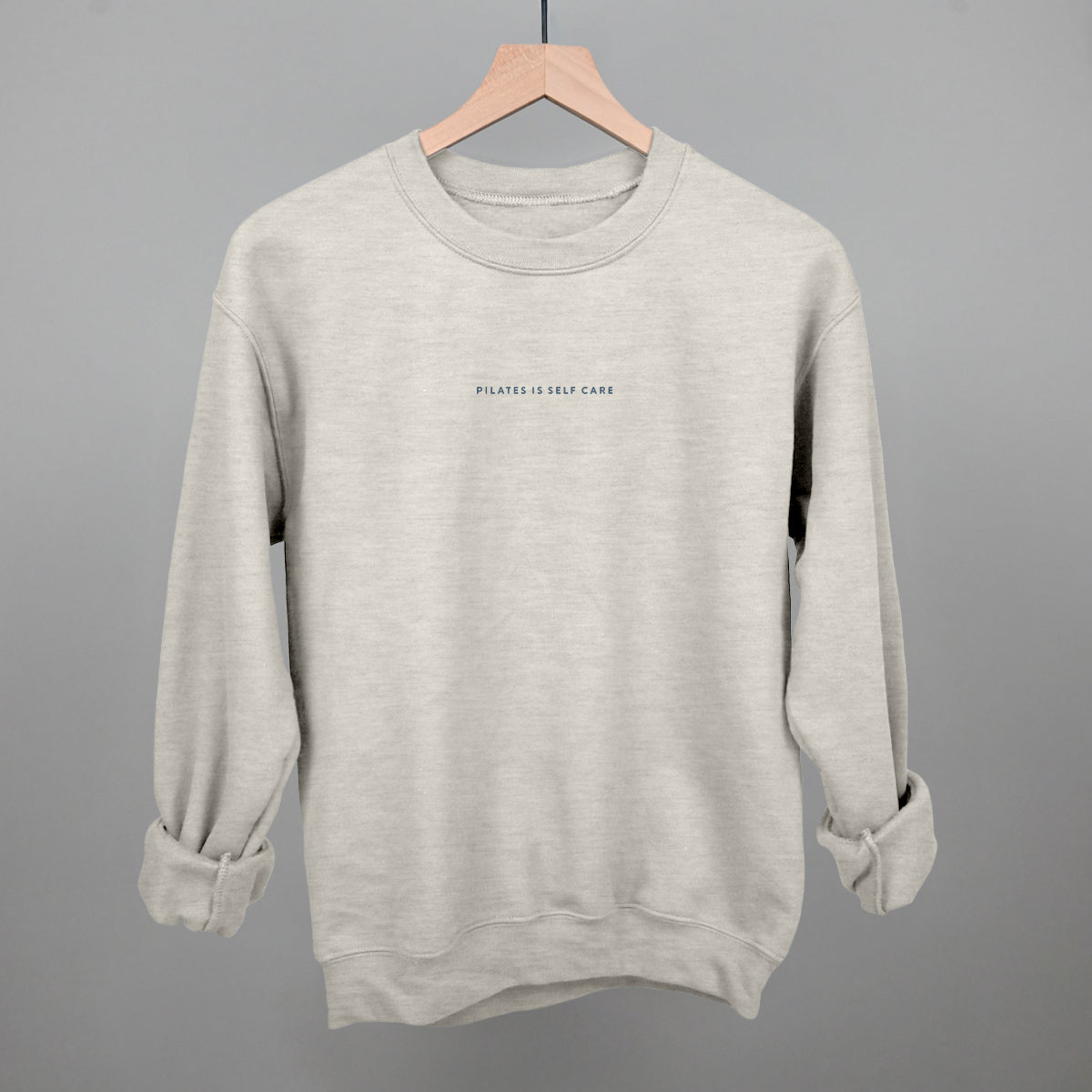 Light blue cotton tee from Ivy + Cloth's Pilates Is Self Care Collection, perfect for cozy athleisure and fitness.