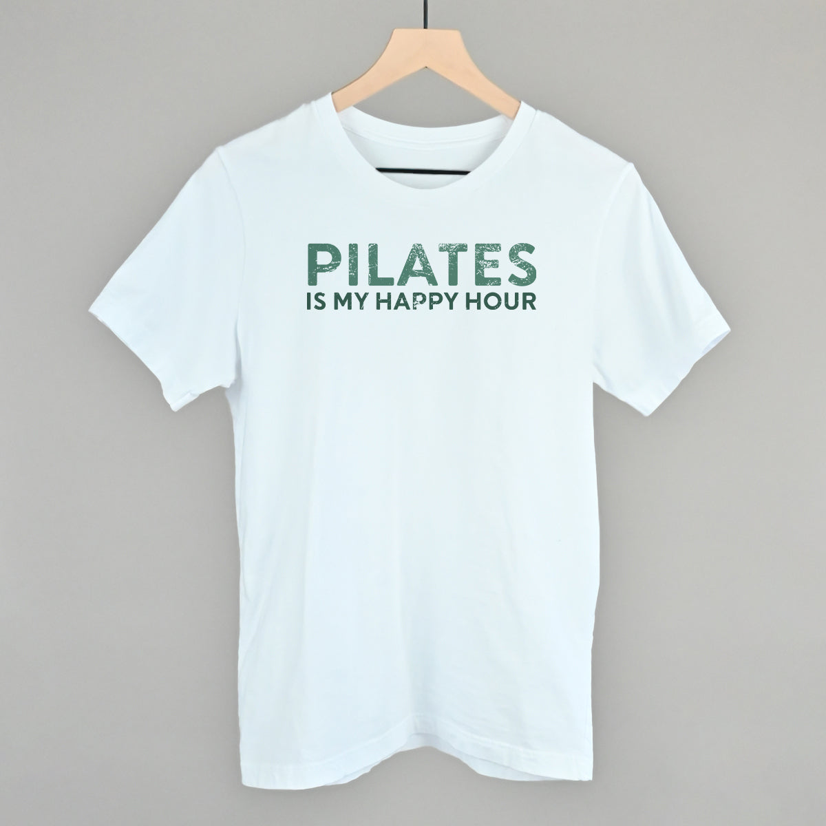 Bay Comfort Colors tee from Ivy + Cloth featuring 'Pilates Is My Happy Hour' slogan, perfect for casual fitness wear.