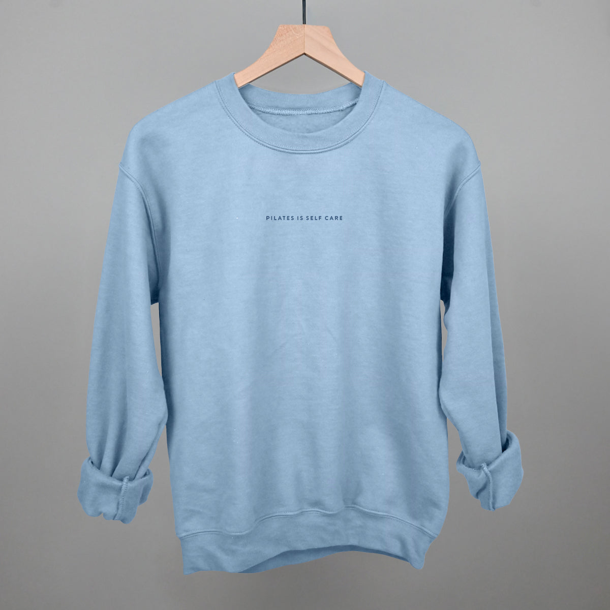 Light blue cotton tee from Ivy + Cloth, part of the Pilates Is Self Care Collection, perfect for cozy athleisure wear.