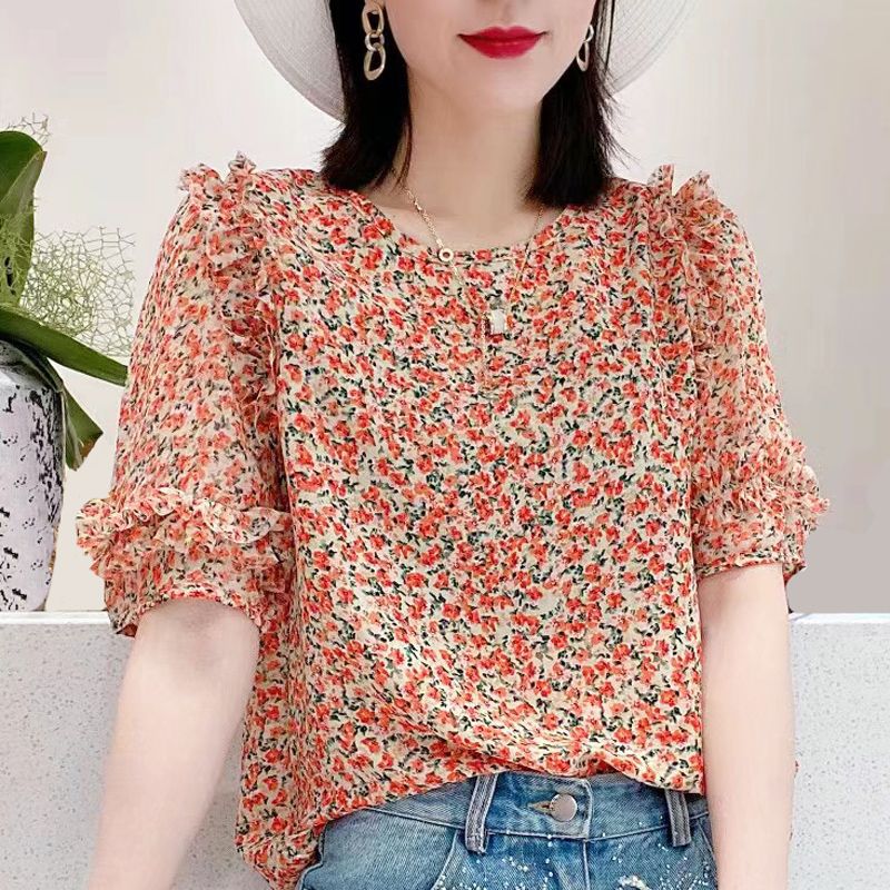 Light blue floral chiffon blouse with ruffle sleeves by Alabaster, featuring a lightweight and breathable design.