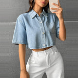 Cropped light blue denim shirt by Alabaster, lightweight cotton, button-up style, perfect for casual wear.