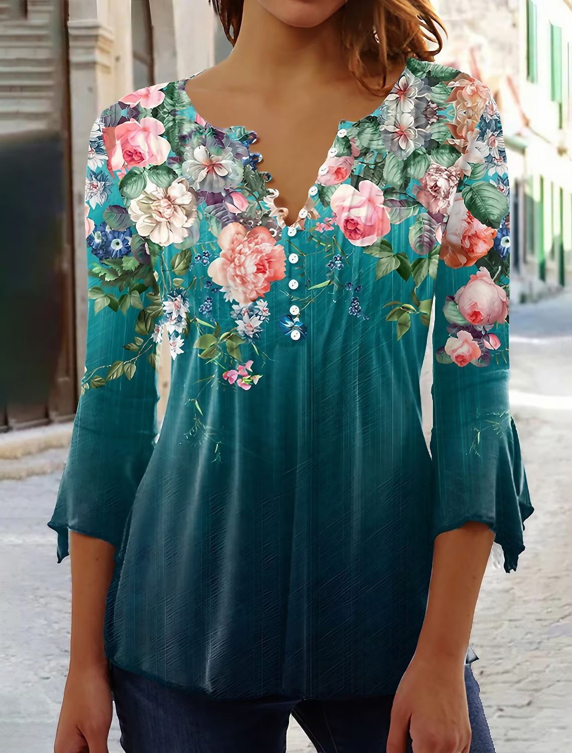 White floral V-neck pleated blouse with 3/4 sleeves and button front by Alabaster
