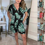 Black lightweight tropical leaf print jumpsuit with V-neck, perfect for summer beach wear by Alabaster.