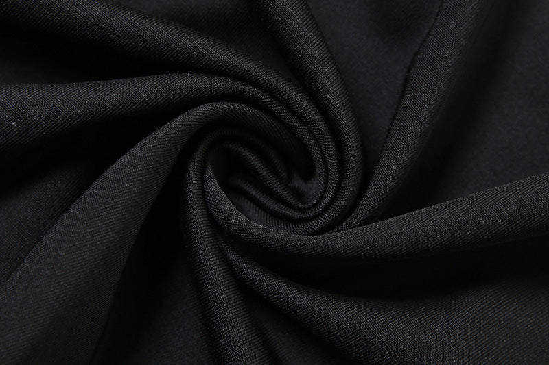 Black elegant suspender dress by Alabaster, curve-hugging design perfect for cocktail parties and date nights.
