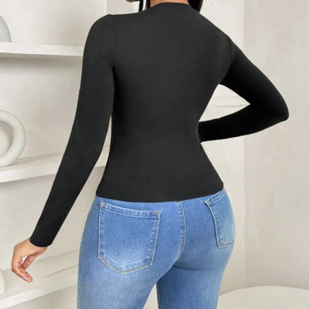 Black pleated collar slim fit top by Alabaster, featuring a curve-hugging design suitable for elegant occasions.