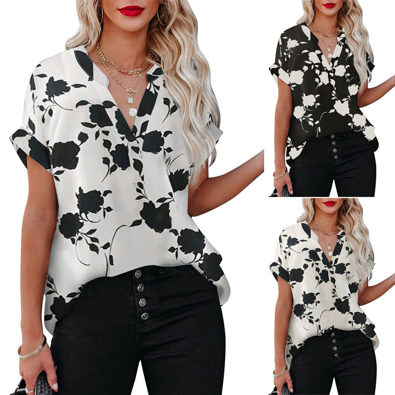 White floral V-neck blouse in lightweight polyester by Alabaster, perfect for summer wear.