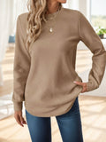 Khaki waffle-textured sweatshirt with asymmetrical hem by Alabaster, available in sizes S, M, L