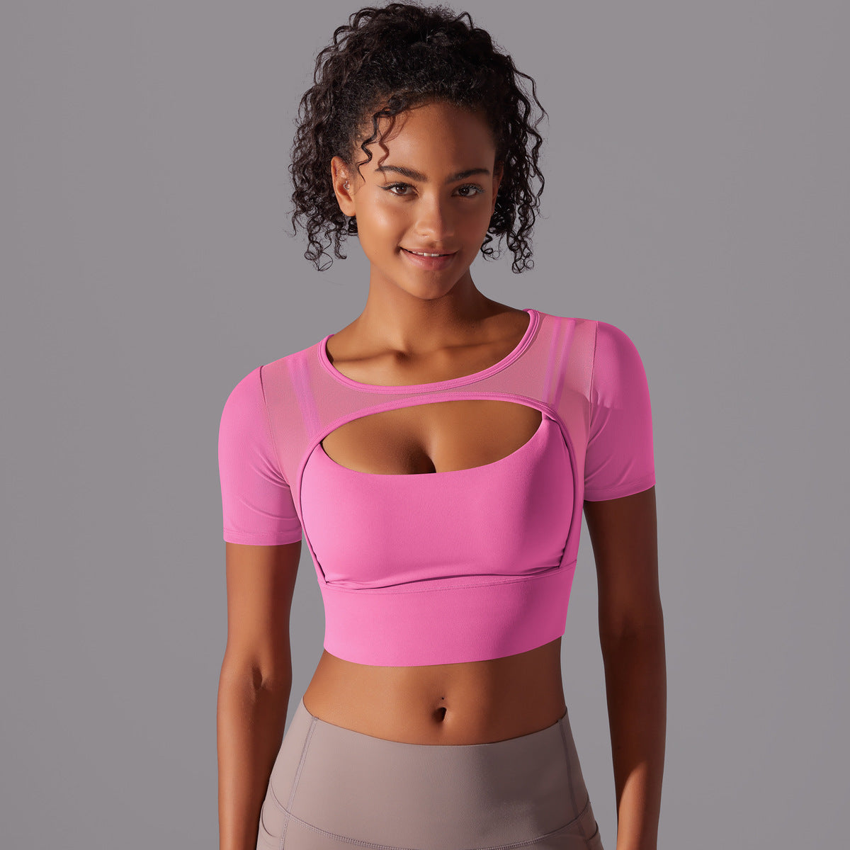 Black mesh double layer cutout sports bra by Alabaster, featuring breathable fabric and body-hugging fit.