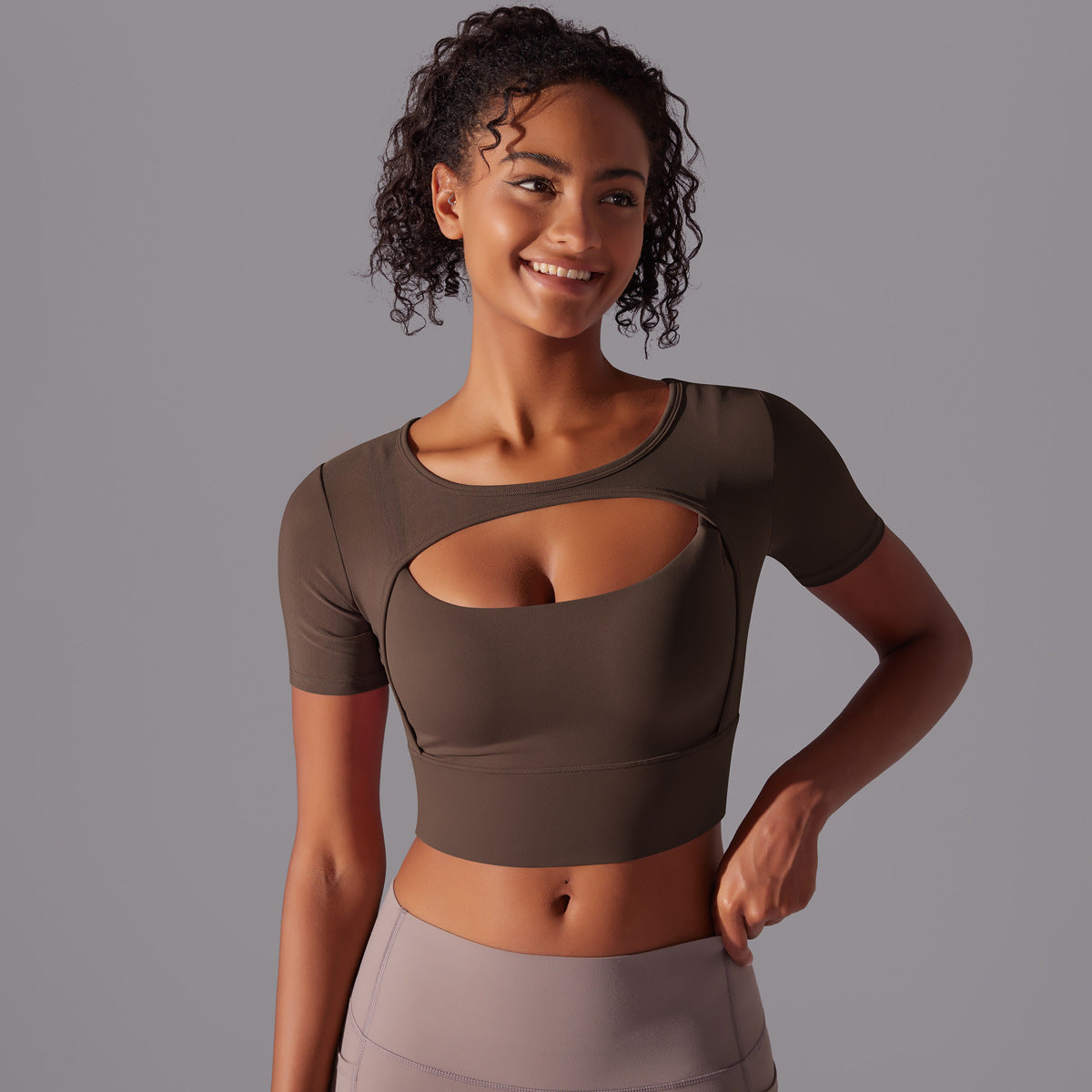 Black mesh double layer cutout sports bra by Alabaster, featuring breathable fabric and body-hugging fit.