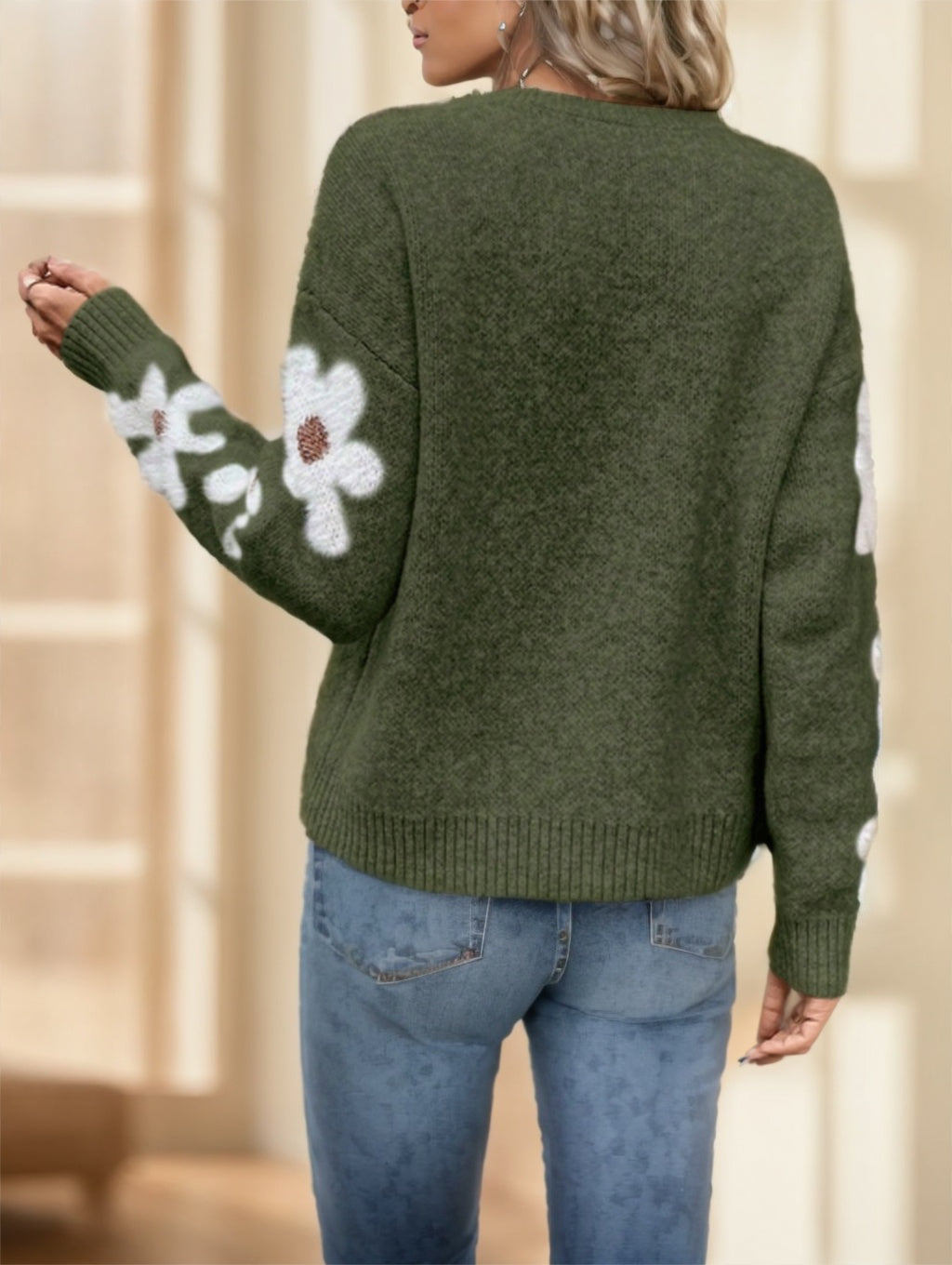 Blue floral drop shoulder knit sweater in polyester by Alabaster, featuring a daisy pattern, perfect for autumn casual wear.