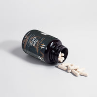 Green bottle of Alpha Energy natural male enhancement supplement with allergen-free capsules and clean label