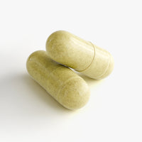 Green capsule supplement bottle labeled NAD+ with Quercetin & Resveratrol by mywellness.health