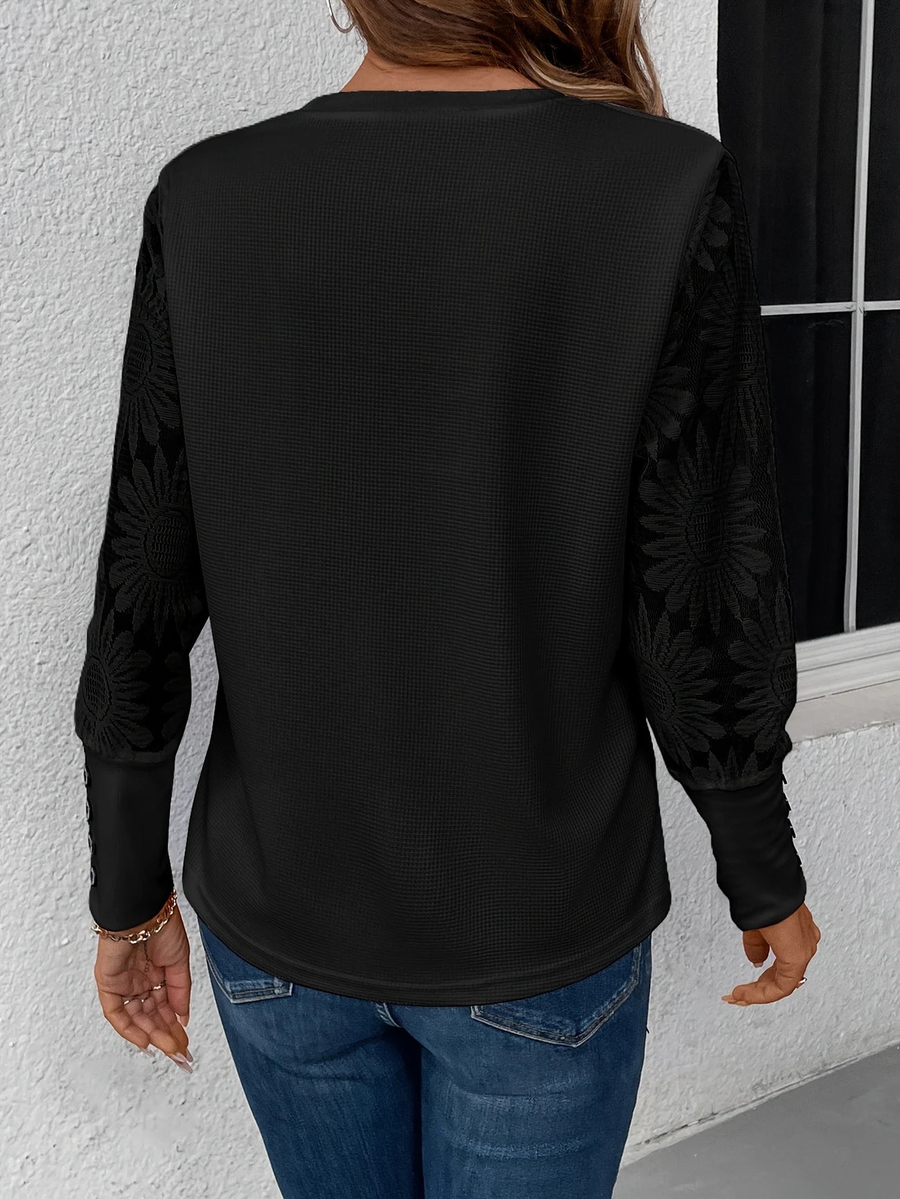 White lace floral long sleeve blouse with buttoned cuffs by Alabaster, featuring a clean silhouette and contrast cuffs.