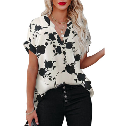 White floral V-neck blouse in lightweight polyester by Alabaster, perfect for summer wear.