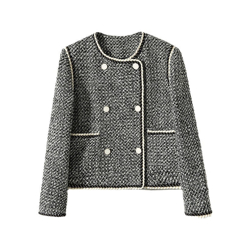 Black and white tweed double-breasted cropped blazer by Alabaster, featuring classic autumn layering style.