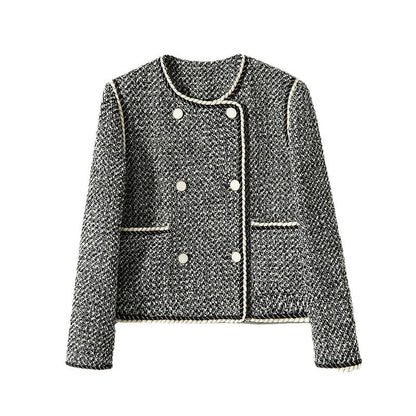 Black and white tweed double-breasted cropped blazer by Alabaster, featuring classic autumn layering style.