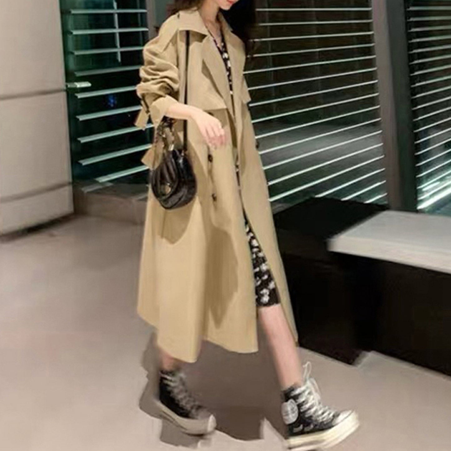 Gray green mid-length oversized trench coat by Alabaster with adjustable cuffs and double-breasted design
