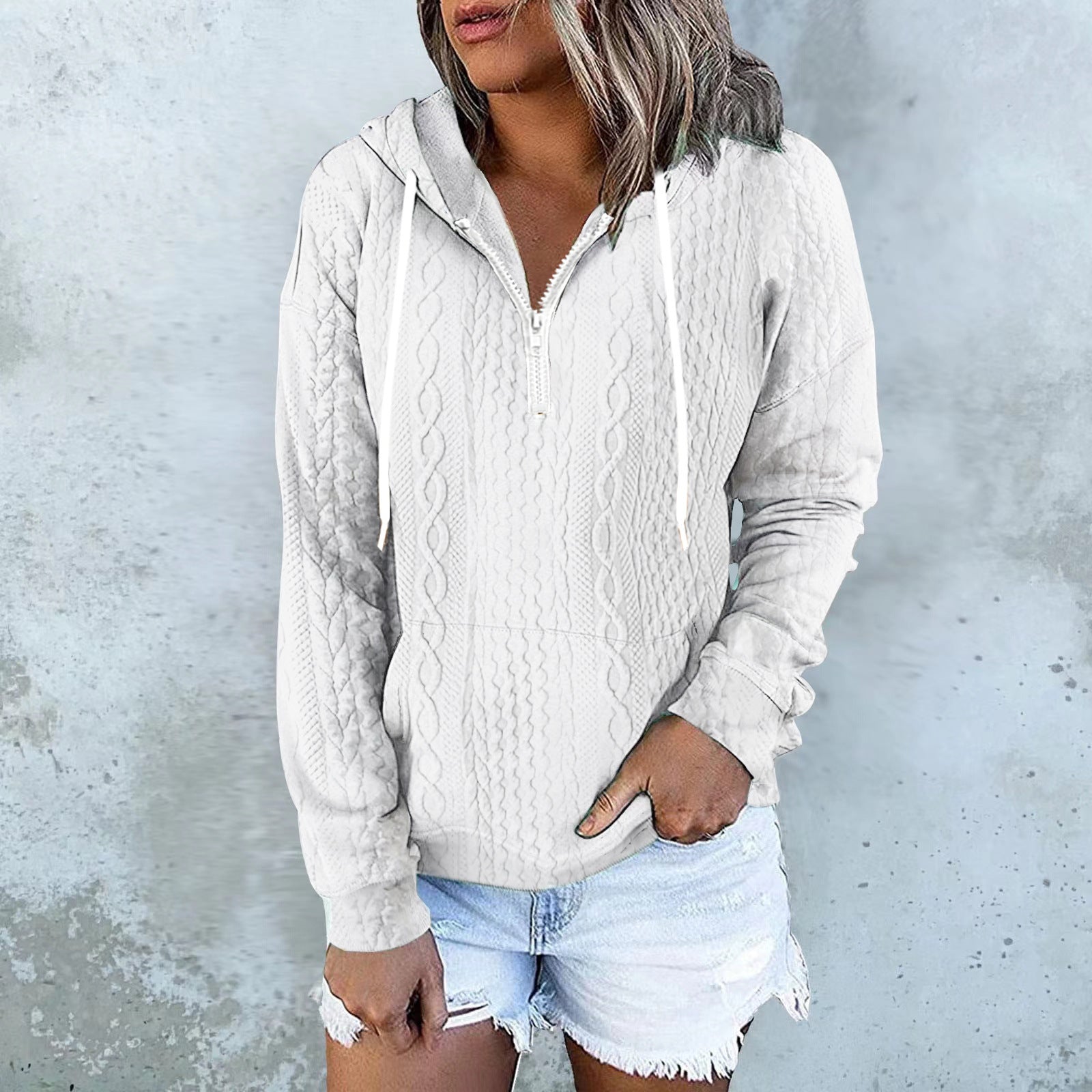 White cable knit zip-up hoodie with drawstring hood for women by Alabaster