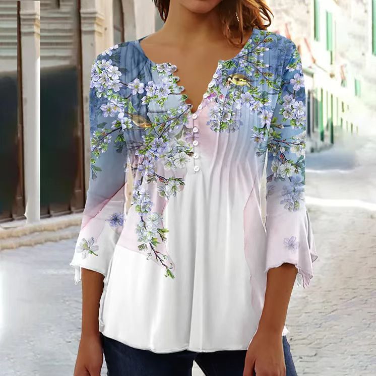 White floral V-neck pleated blouse with 3/4 sleeves and button front by Alabaster