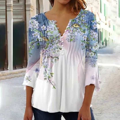 White floral V-neck pleated blouse with 3/4 sleeves and button front by Alabaster