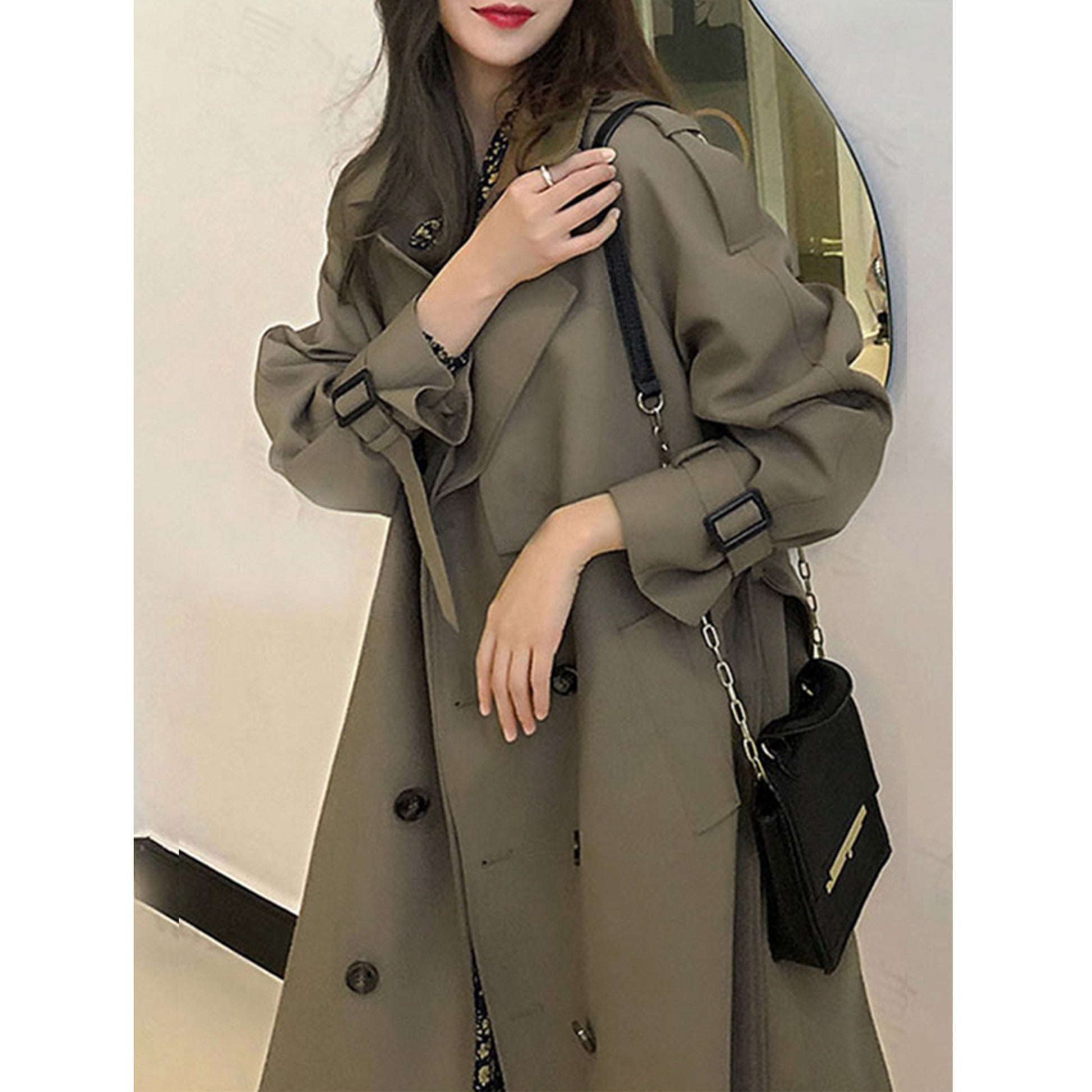 Gray green oversized mid-length trench coat with adjustable cuffs and double-breasted front by Alabaster