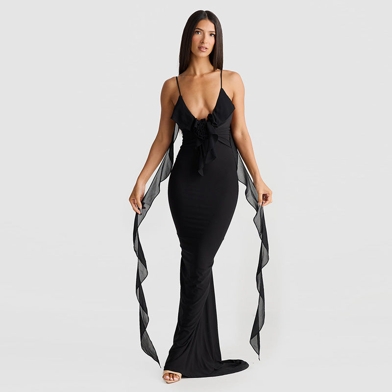 Black elegant suspender dress by Alabaster, curve-hugging design suitable for cocktail or date night.
