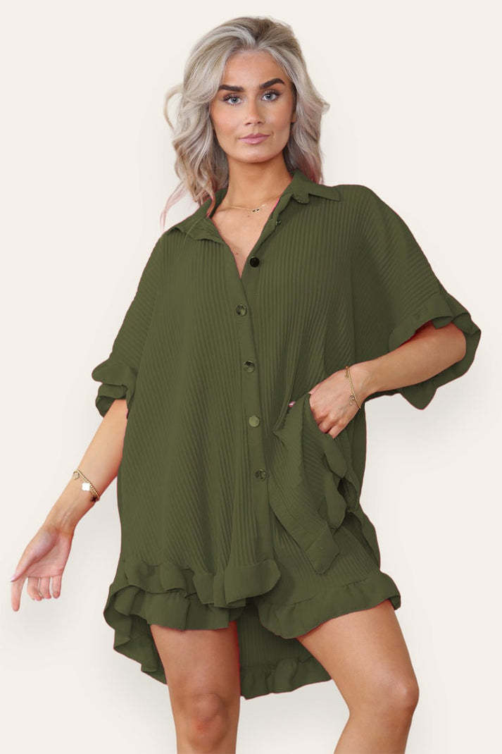 Turquoise women's ruffle co-ord set featuring an oversized button shirt and shorts by Alabaster with gold buttons.