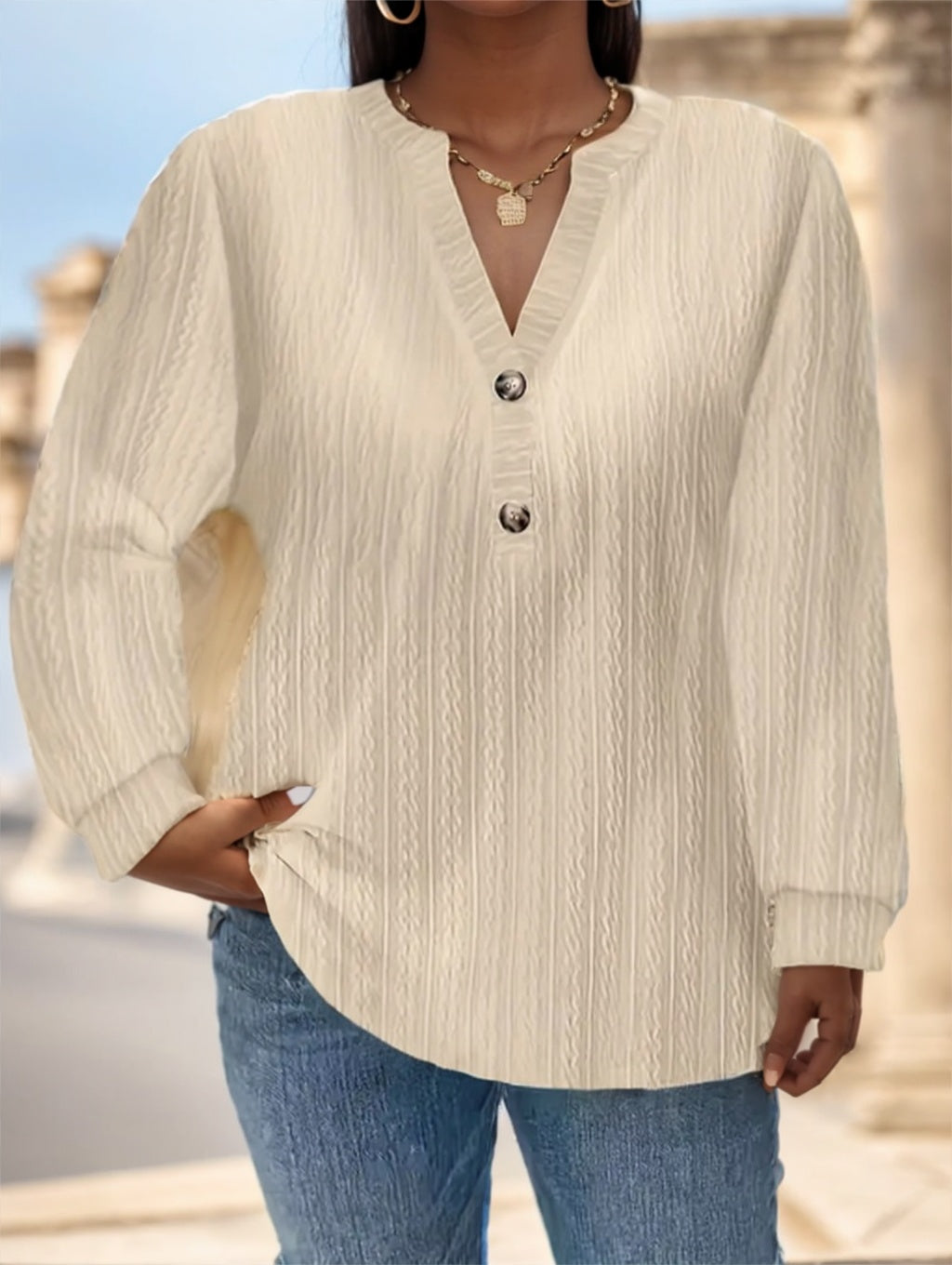 Black long sleeve shirt with button detail, by Alabaster, available in sizes S, M, L