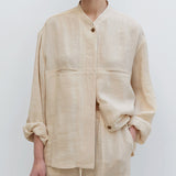 White pure linen pocket shirt by Alabaster, featuring a casual-elegant style in breathable fabric.