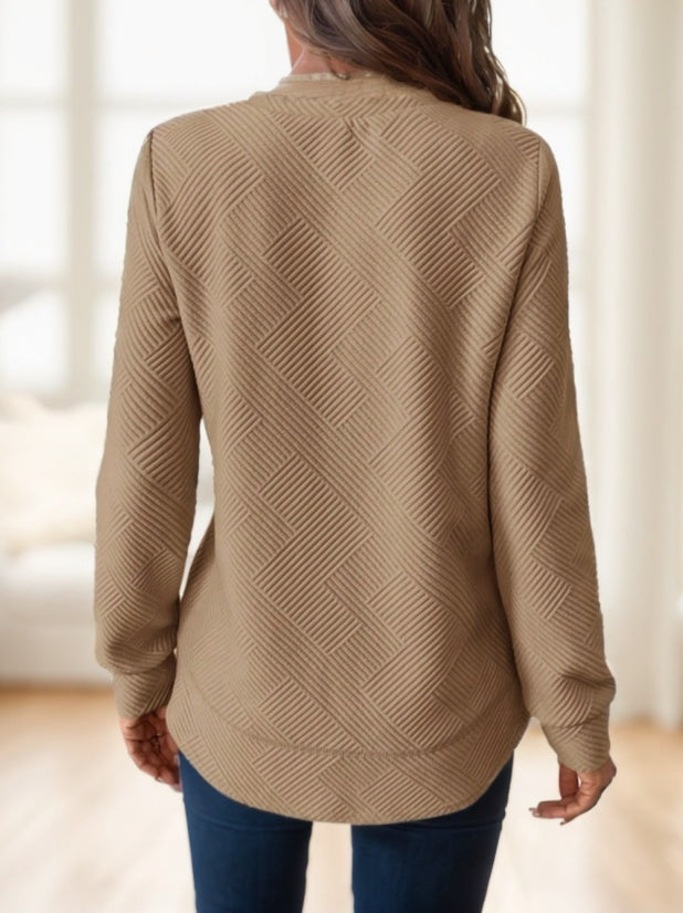 Khaki waffle-textured sweatshirt with asymmetrical hem by Alabaster, available in sizes S, M, and L.