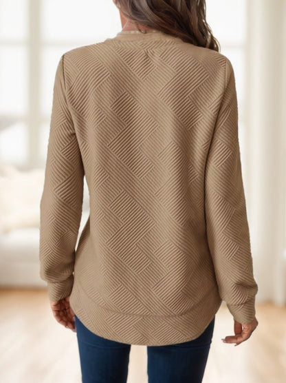 Khaki waffle-textured sweatshirt with asymmetrical hem by Alabaster, available in sizes S, M, and L.