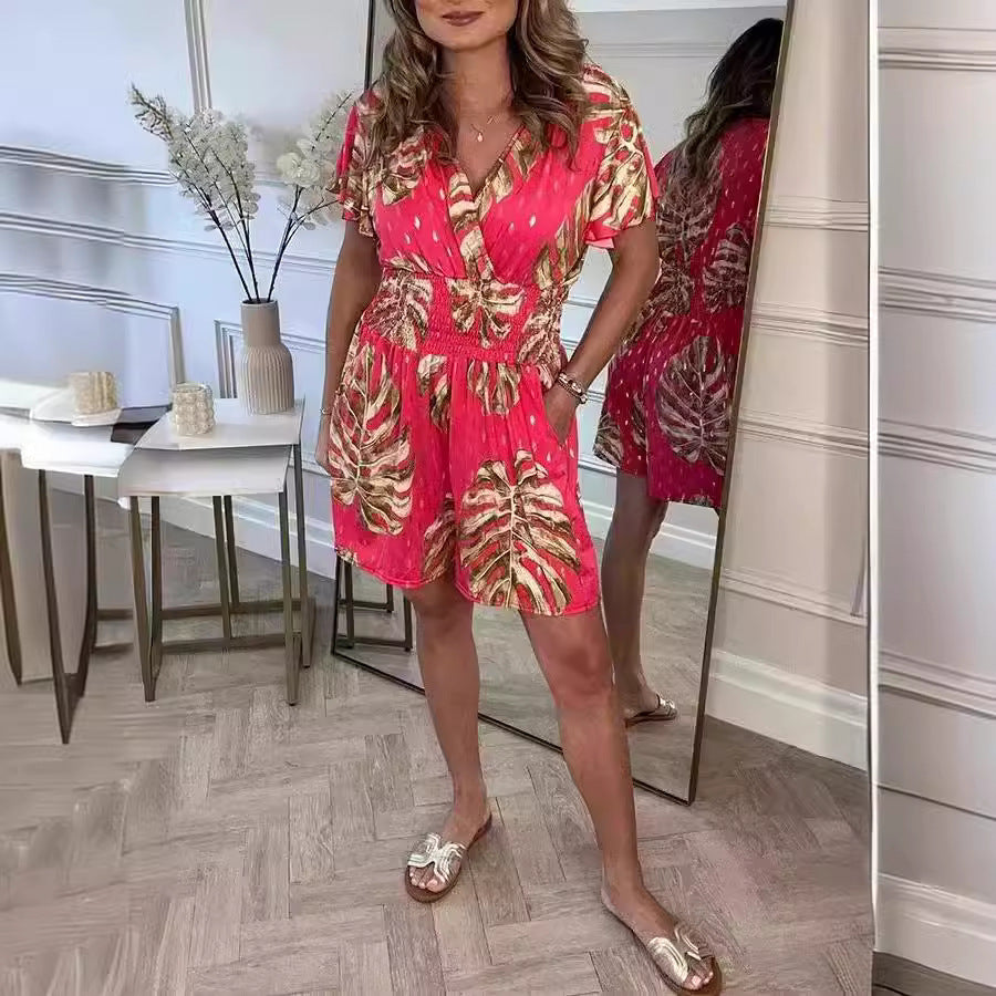Black lightweight tropical leaf print jumpsuit with V-neck, perfect for summer beach wear and casual outings
