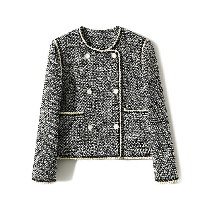 Black and white tweed double-breasted cropped blazer by Alabaster, featuring a classic design for autumn layering.