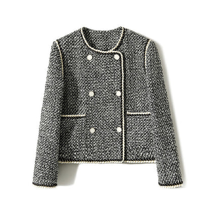 Black and white tweed double-breasted cropped blazer by Alabaster, featuring a classic design for autumn layering.