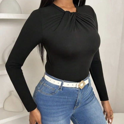 Black pleated collar slim fit top by Alabaster, featuring a curve-hugging design, suitable for elegant occasions.