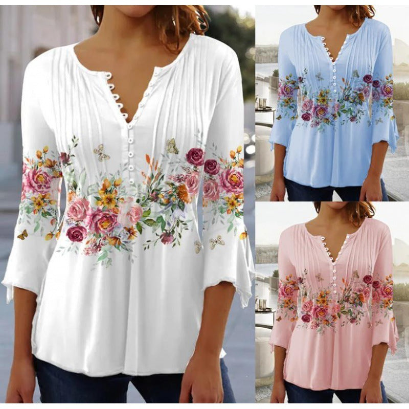 White floral V-neck pleated blouse with 3/4 sleeves and button front by Alabaster