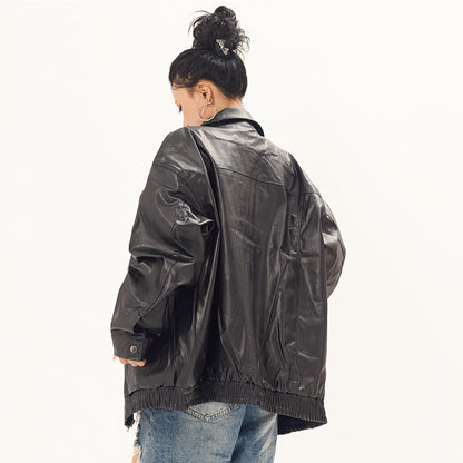 Black oversized punk moto PU leather jacket by Alabaster with button closure and biker style