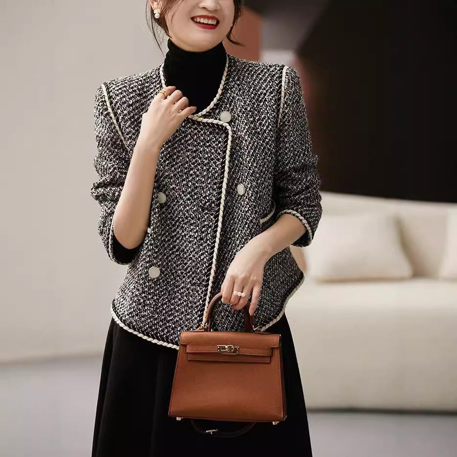 Black and white tweed double-breasted short coat by Alabaster, perfect for autumn layering.