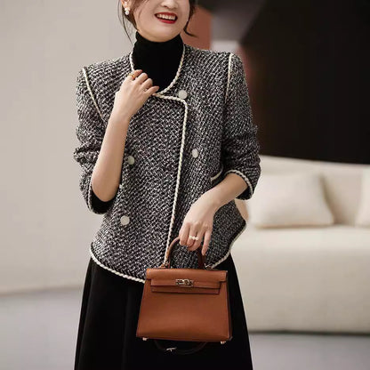 Black and white tweed double-breasted short coat by Alabaster, perfect for autumn layering.