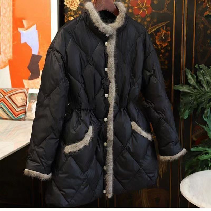 Beige quilted winter coat with faux fur trim and cinch waist by Alabaster