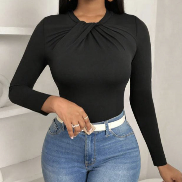 Black pleated collar slim fit top by Alabaster, featuring a curve-hugging design, perfect for elegant occasions.