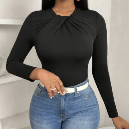 Black pleated collar slim fit top by Alabaster, featuring a curve-hugging design, perfect for elegant occasions.