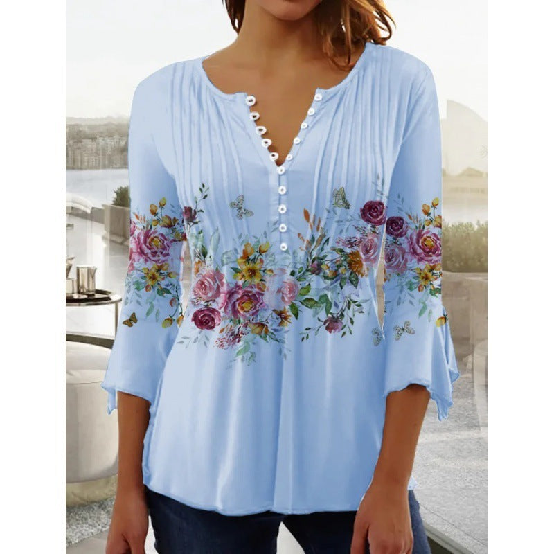White floral V-neck pleated blouse with 3/4 sleeves and button front by Alabaster