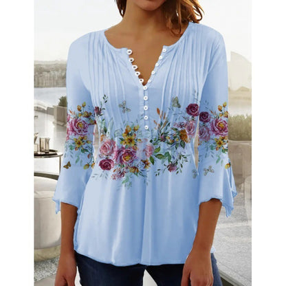 White floral V-neck pleated blouse with 3/4 sleeves and button front by Alabaster