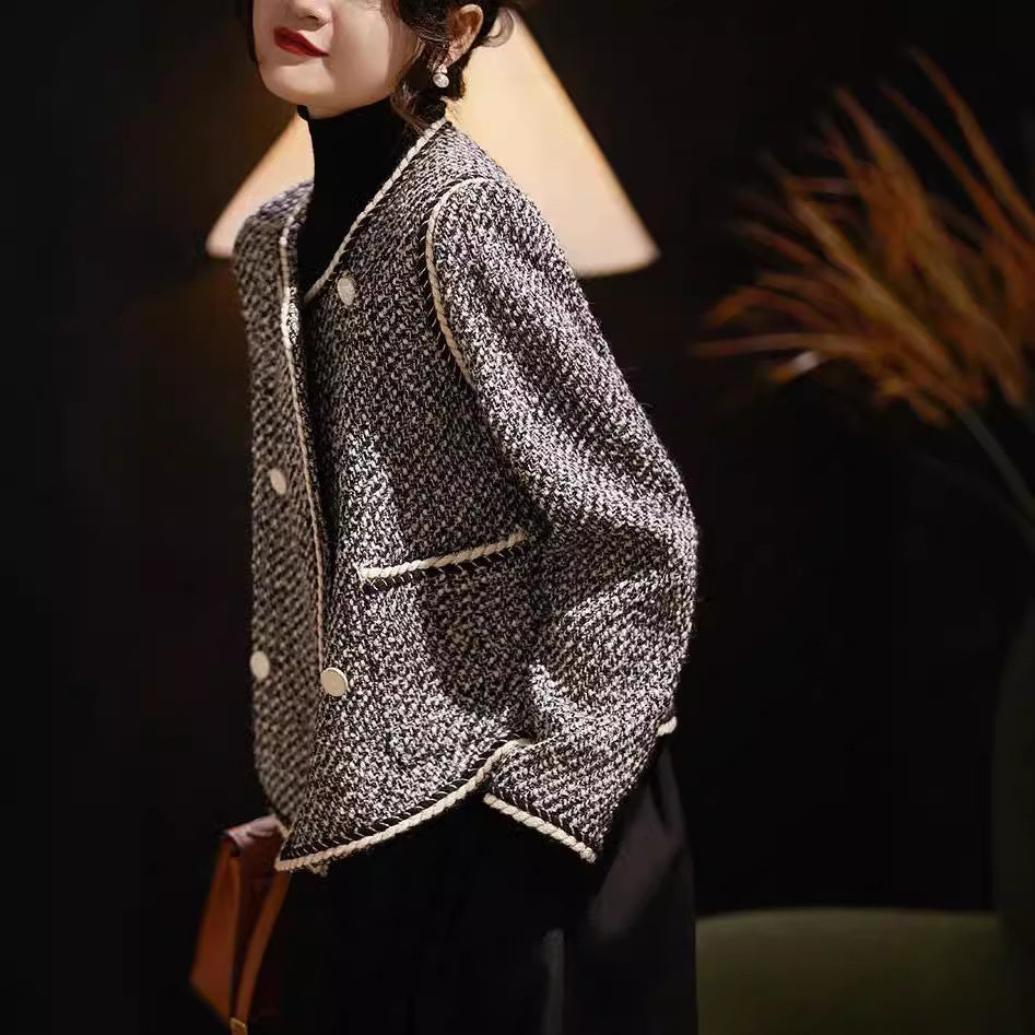 Black and white tweed double-breasted short coat by Alabaster, perfect for autumn layering.